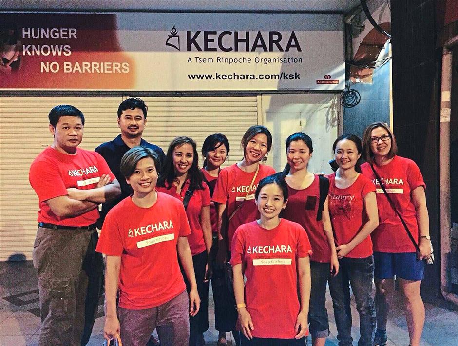 Zatashah was recently on the streets to volunteer at Kechara Soup Kitchen, here she is with the other volunteers. Photo: Tengku Zatashah