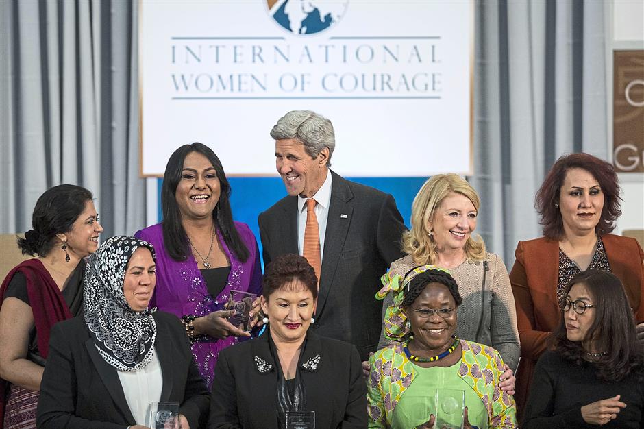 Secretary of State John Kerry chats with Nisha and other honorees during a ceremony to present the 2016 Secretary of States International Women of Courage Award at the State Department in 2016 in Washington, DC. Photo: AFP