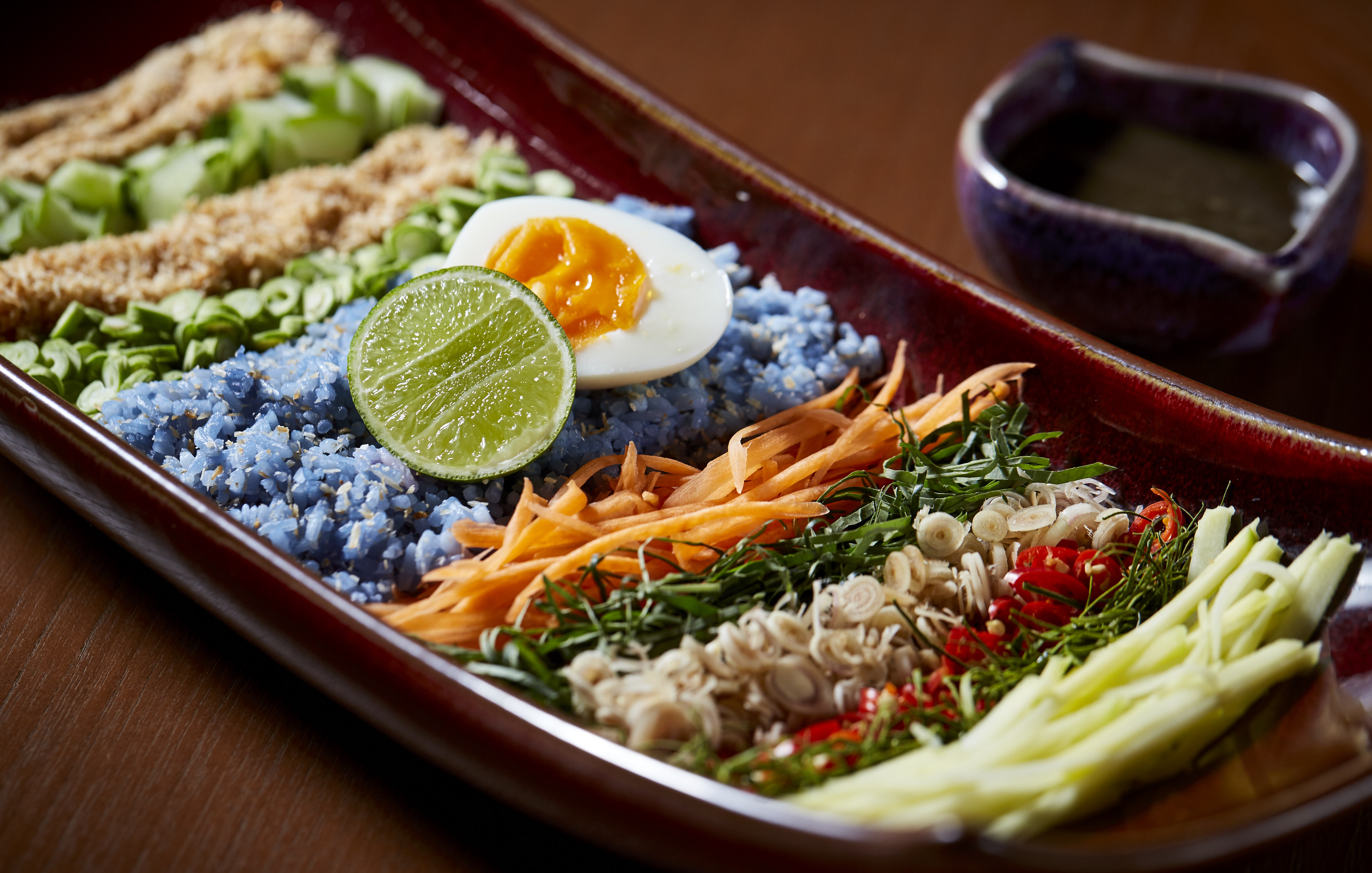 Khao Yum Pak Tai, a rice salad with kaffir lime, lemongrass, dried shrimp and coconut,